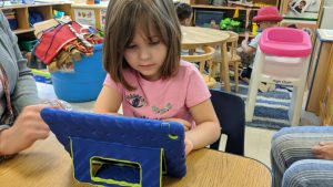 Central Davie preschool student Serenity Rose works with Cognitive ToyBox