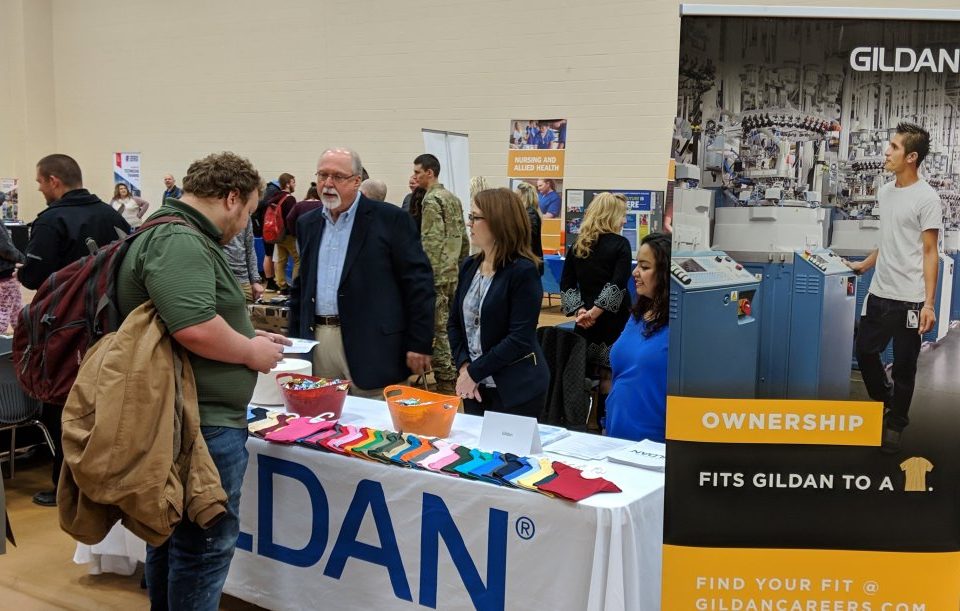 Student learns about career options and opportunities at Gildan during 2019 Career Expo at Davie County High School