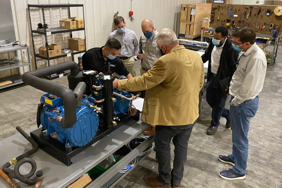 Nick Ganaga of CryoBuilt is inspecting an assembly that the Pro Refrigeration Team built to Cryobuilt’s specification. (L to R) Nick Ganaga (Cryo), Ben Hicks (Pro), Jon Riesenweber (Pro), Sam Wilson (Cryo), Alphonse Wade (Pro), and Brett Cocking (Pro)