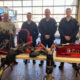 (L to R) Chief Frank Carter, Captain Cameron Cheppell, Lieutenant C.J. Dwiggins, Firefighter Joshua Collins, and Firefighter Chris Shoffner were instrumental in helping the Mocksville Fire Department achieve its heavy rescue certification. The hydraulic cutter & spreader, AJAX pneumatic breaker, metal saws and rope gear bags on the table represent a portion of the $50,000 worth of equipment the certification required.