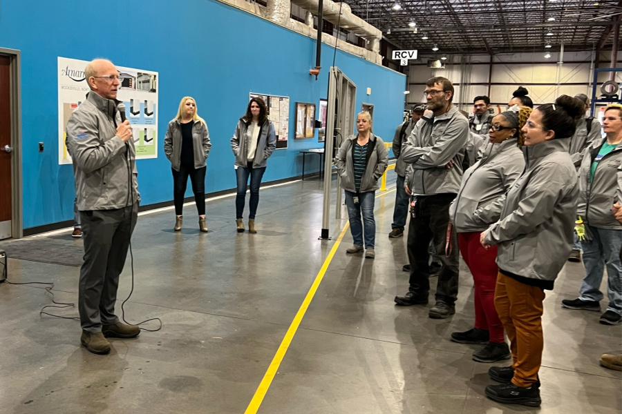 Rob Chesser, vice president of manufacturing, congratulates Amarr team members on SHARP certification. 